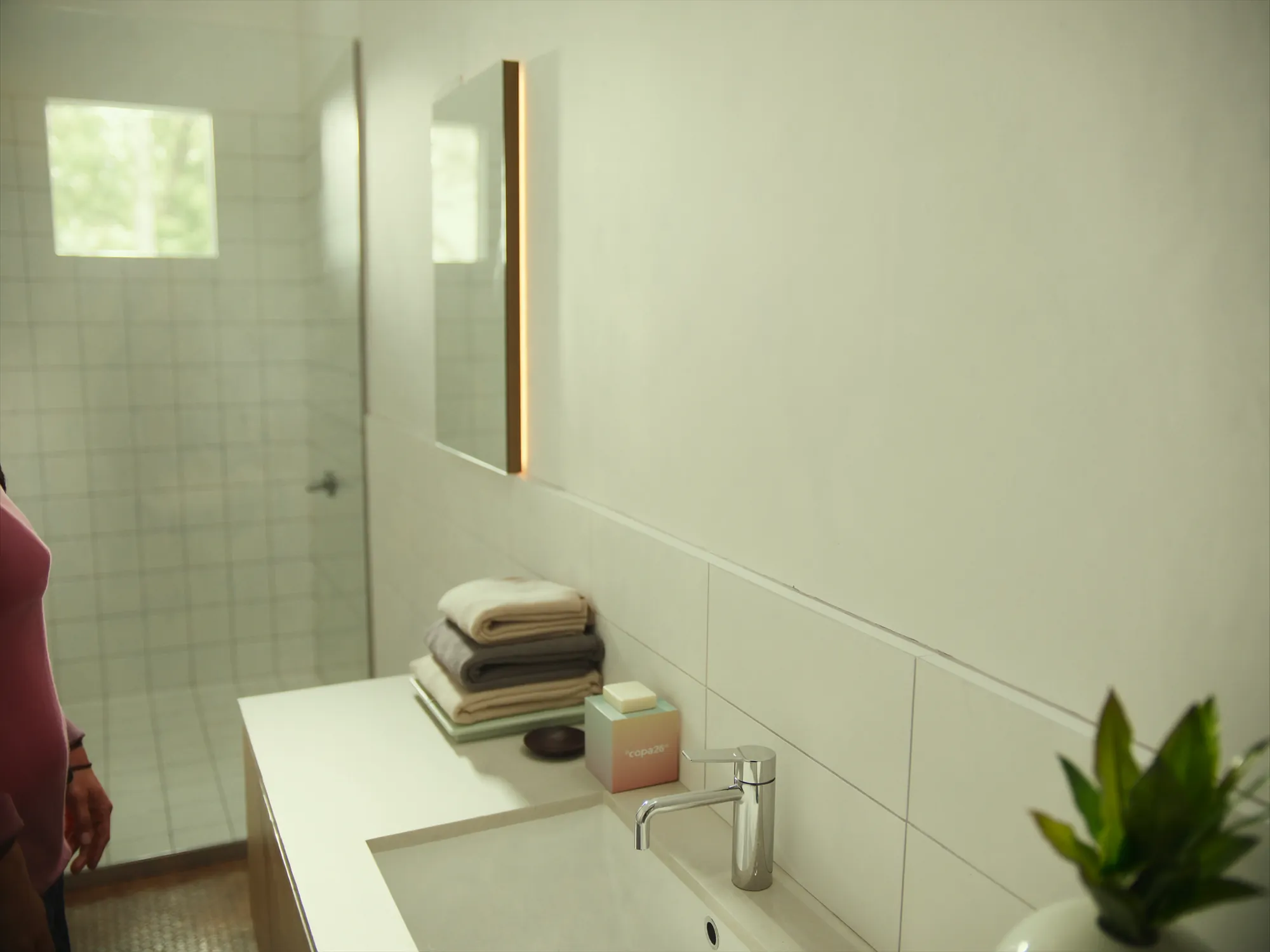 Clean, bright bathroom with fresh towels
